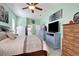 Well-decorated main bedroom suite with dressers and decor at 13855 Rudi Loop, Spring Hill, FL 34609