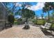 Outdoor patio area featuring a fire pit and comfortable seating, perfect for entertaining guests at 13855 Rudi Loop, Spring Hill, FL 34609