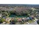 Community aerial view featuring homes surrounding a scenic lake and lush green landscaping at 14917 Barby Ave, Tampa, FL 33625