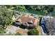 Aerial view of property, featuring a pool, lush landscaping, and serene waterfront at 14917 Barby Ave, Tampa, FL 33625