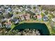 Ariel view of homes backing up to a scenic lake, offering a picturesque waterfront view at 14917 Barby Ave, Tampa, FL 33625