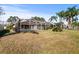 Expansive backyard with a screened pool enclosure, providing privacy and relaxation at 14917 Barby Ave, Tampa, FL 33625