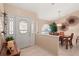 Inviting foyer with tile flooring, decorative glass door, and view into the dining area at 14917 Barby Ave, Tampa, FL 33625