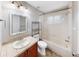 Bathroom with a tub and shower combo, tile floor, and single sink vanity at 15901 Benton Ct, Tampa, FL 33647