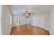 Bedroom with a ceiling fan, wood floors, walk-in closet, and natural light at 15901 Benton Ct, Tampa, FL 33647