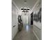 Inviting foyer featuring stylish decor, a statement chandelier, and tiled flooring at 17736 Hickok Belt Loop, Bradenton, FL 34211