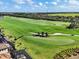 Scenic golf course view with lush green fairways and manicured landscaping, backing up to private residences at 17736 Hickok Belt Loop, Bradenton, FL 34211