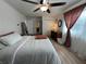 Cozy bedroom with modern ceiling fan and fixtures, and white walls at 1919 E Noel St, Tampa, FL 33610