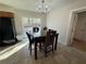 Bright dining area with stylish table, chairs and sliding glass doors at 1919 E Noel St, Tampa, FL 33610