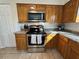 Close up on the kitchen featuring stainless steel appliances and granite countertops at 1919 E Noel St, Tampa, FL 33610