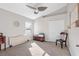 Bedroom featuring neutral carpet, large window, and a double closet for ample storage at 2037 Blue River Rd, Holiday, FL 34691