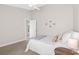 Cozy bedroom with carpet, a ceiling fan, and a neutral color palette at 2037 Blue River Rd, Holiday, FL 34691