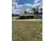 View of a utility shed on the property lot, backed by trees at 2102 W Ivy St, Tampa, FL 33607