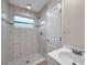 Bathroom features tiled shower, a window, and a vanity with a single sink at 2151 E Leewynn Dr, Sarasota, FL 34240