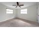 Neutral bedroom with plush carpet, and two bright windows at 2151 E Leewynn Dr, Sarasota, FL 34240