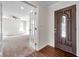 View of the entryway, foyer, and living room featuring tile flooring, and lots of natural light at 2151 E Leewynn Dr, Sarasota, FL 34240