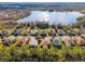 Stunning aerial view of lakeside homes, showcasing lush landscaping and serene water views at 21537 Draycott Way, Land O Lakes, FL 34637