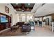 Bright living room with coffered ceilings, ceiling fan, and bar-style seating to the kitchen at 21537 Draycott Way, Land O Lakes, FL 34637