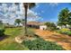 Mature landscaping and brick driveway enhance the curb appeal of this beautiful single-Gathering home at 2359 Emerald Lake Dr, Sun City Center, FL 33573