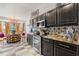 Elegant kitchen featuring stainless steel appliances and stylish tile backsplash at 2359 Emerald Lake Dr, Sun City Center, FL 33573