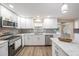 Modern kitchen with an island, stainless steel appliances and gray backsplash at 239 Freeport Ne Ave, St Petersburg, FL 33702