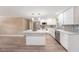 Modern kitchen area with stainless steel appliances, an island, and open sight lines at 239 Freeport Ne Ave, St Petersburg, FL 33702