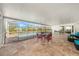 Covered patio featuring a tile floor, glass table and an outdoor living space with pool view at 239 Freeport Ne Ave, St Petersburg, FL 33702