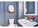 Stylish powder room featuring gray walls, decorative turtle art, and a white vessel sink at 2510 W Cleveland St # 3, Tampa, FL 33609