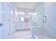 Bright bathroom with double sinks, a glass-enclosed shower, and modern fixtures at 2510 W Cleveland St # 3, Tampa, FL 33609