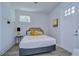 Bright bedroom featuring a rattan headboard bed and natural light from the window at 2510 W Cleveland St # 3, Tampa, FL 33609