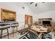 Open dining area with bar seating, connecting to the kitchen, with tiled floors and ample natural light at 2940 Bay View Dr, Safety Harbor, FL 34695