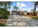 Charming one-story home featuring a well-maintained front yard and a spacious driveway for convenient parking at 2940 Bay View Dr, Safety Harbor, FL 34695