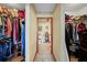 Hallway view between two walk-in closets to the bathroom at 2940 Bay View Dr, Safety Harbor, FL 34695