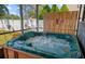 Relaxing hot tub with colorful butterfly decor in a screened-in outdoor space at 2940 Bay View Dr, Safety Harbor, FL 34695