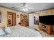 Bedroom with tile floors, a ceiling fan, and doorways leading to other rooms at 2940 Bay View Dr, Safety Harbor, FL 34695