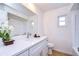 Modern bathroom featuring a sleek quartz countertop, updated fixtures, and a stylish decorative plant at 3046 Lake Padgett Dr, Land O Lakes, FL 34639