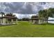 Community park with multiple gazebos and picnic tables by the serene lake at 3046 Lake Padgett Dr, Land O Lakes, FL 34639