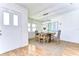 Cozy dining area with rustic table, modern lighting, and natural light at 3046 Lake Padgett Dr, Land O Lakes, FL 34639