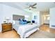 Calming main bedroom with a comfortable bed, ceiling fan, and stylish decor at 3046 Lake Padgett Dr, Land O Lakes, FL 34639