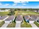 New homes boast attached garages and manicured lawns in a peaceful neighborhood with an expansive green space at 3664 Zephyr Preserve Pl, Zephyrhills, FL 33541