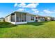 Expansive backyard with a screened patio, perfect for outdoor enjoyment at 3664 Zephyr Preserve Pl, Zephyrhills, FL 33541