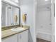 Bathroom featuring a shower-tub combo, single sink vanity, and neutral walls at 423 Windrush Bay Dr, Tarpon Springs, FL 34689