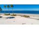 Beach view offering direct access to the ocean with a relaxing bench at 423 Windrush Bay Dr, Tarpon Springs, FL 34689