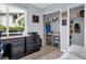 Bright bedroom featuring a window overlooking the garden and a closet with shelving for organization at 423 Windrush Bay Dr, Tarpon Springs, FL 34689