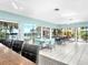 Spacious clubhouse featuring tile flooring, dining tables and chairs, bar seating, and abundant natural light at 423 Windrush Bay Dr, Tarpon Springs, FL 34689