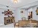 Dining room with wooden table, chairs, and decorative furniture at 423 Windrush Bay Dr, Tarpon Springs, FL 34689