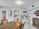 A bright dining room with bar seating and an adjacent kitchenette at 423 Windrush Bay Dr, Tarpon Springs, FL 34689