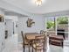 Light-filled dining room with table, chairs, and backyard view at 423 Windrush Bay Dr, Tarpon Springs, FL 34689