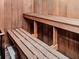 Relaxing sauna with wooden benches and walls at 423 Windrush Bay Dr, Tarpon Springs, FL 34689