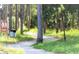 Scenic walking trail winding through a serene, wooded community perfect for outdoor enthusiasts and nature lovers at 423 Windrush Bay Dr, Tarpon Springs, FL 34689